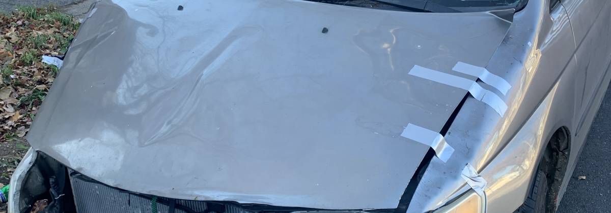 A badly damaged car fit to be sold to a junkyard